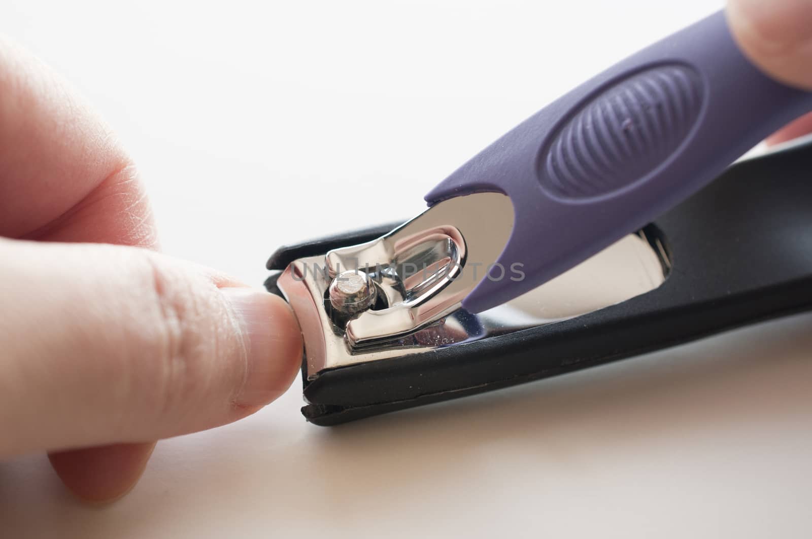 Hand manicure with nail clipper