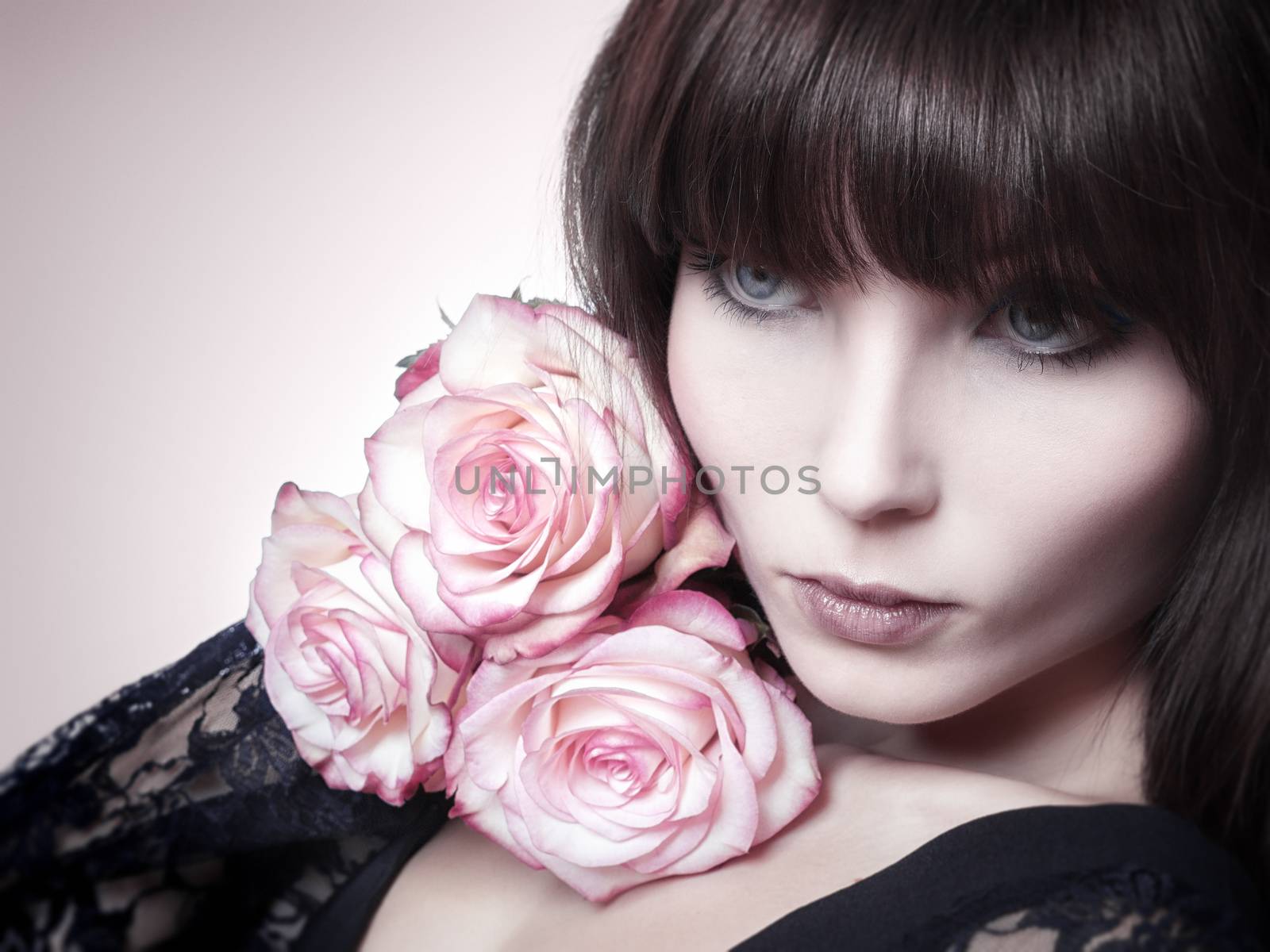 An image of a beautiful woman and roses