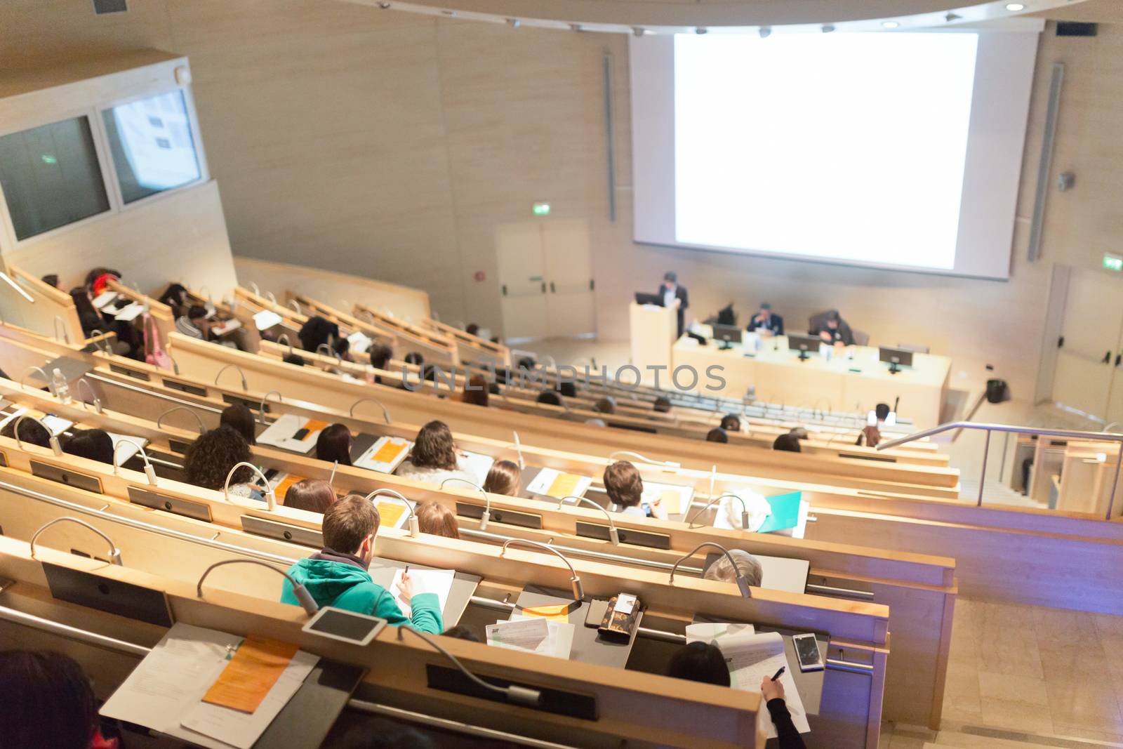 Conference and Presentation. Audience at the conference hall. Business and Entrepreneurship. Faculty lecture and workshop. Audience in the lecture hall. Academic education. Student making notes.