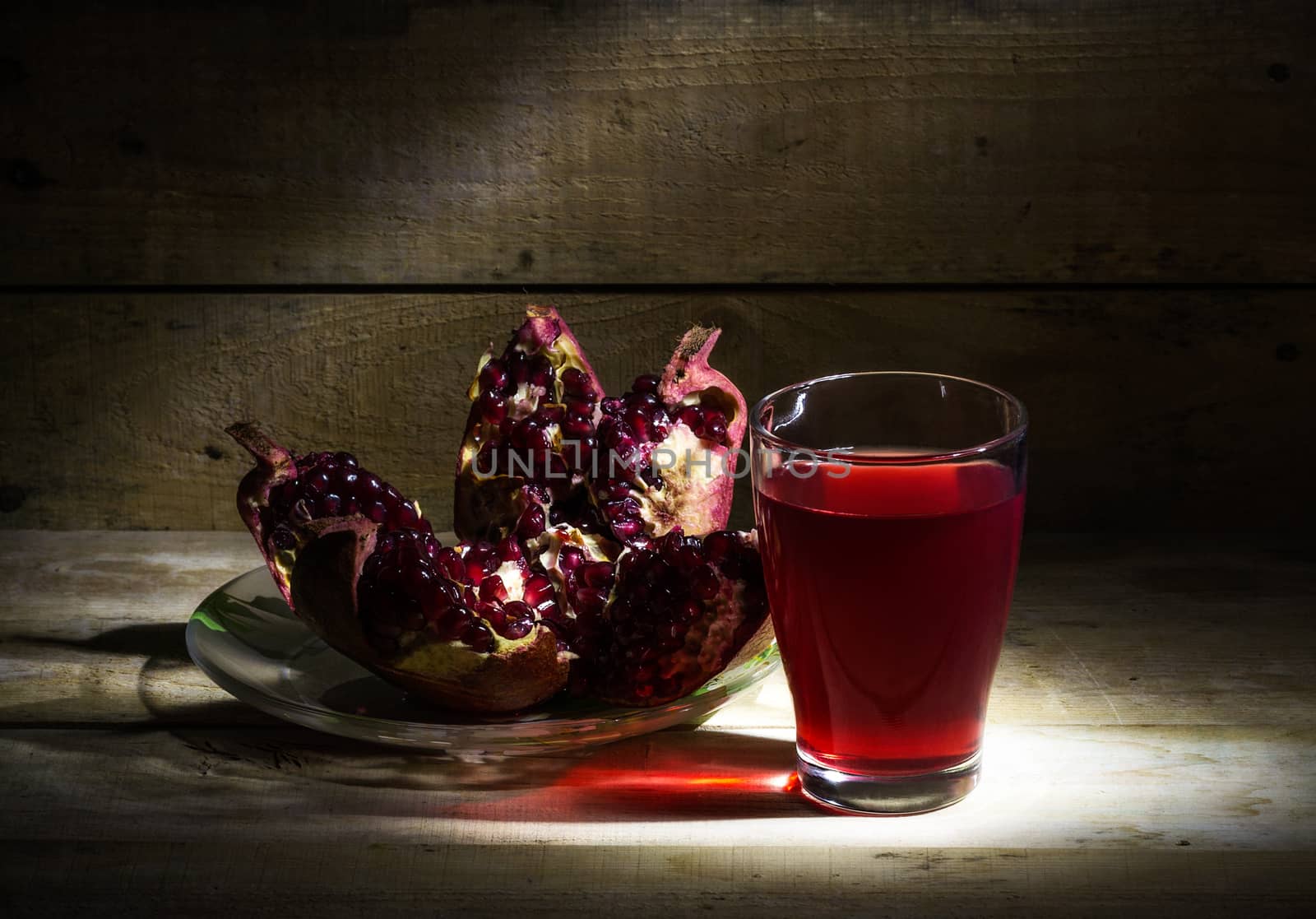 Still life with pomegranate and pomegranate juice