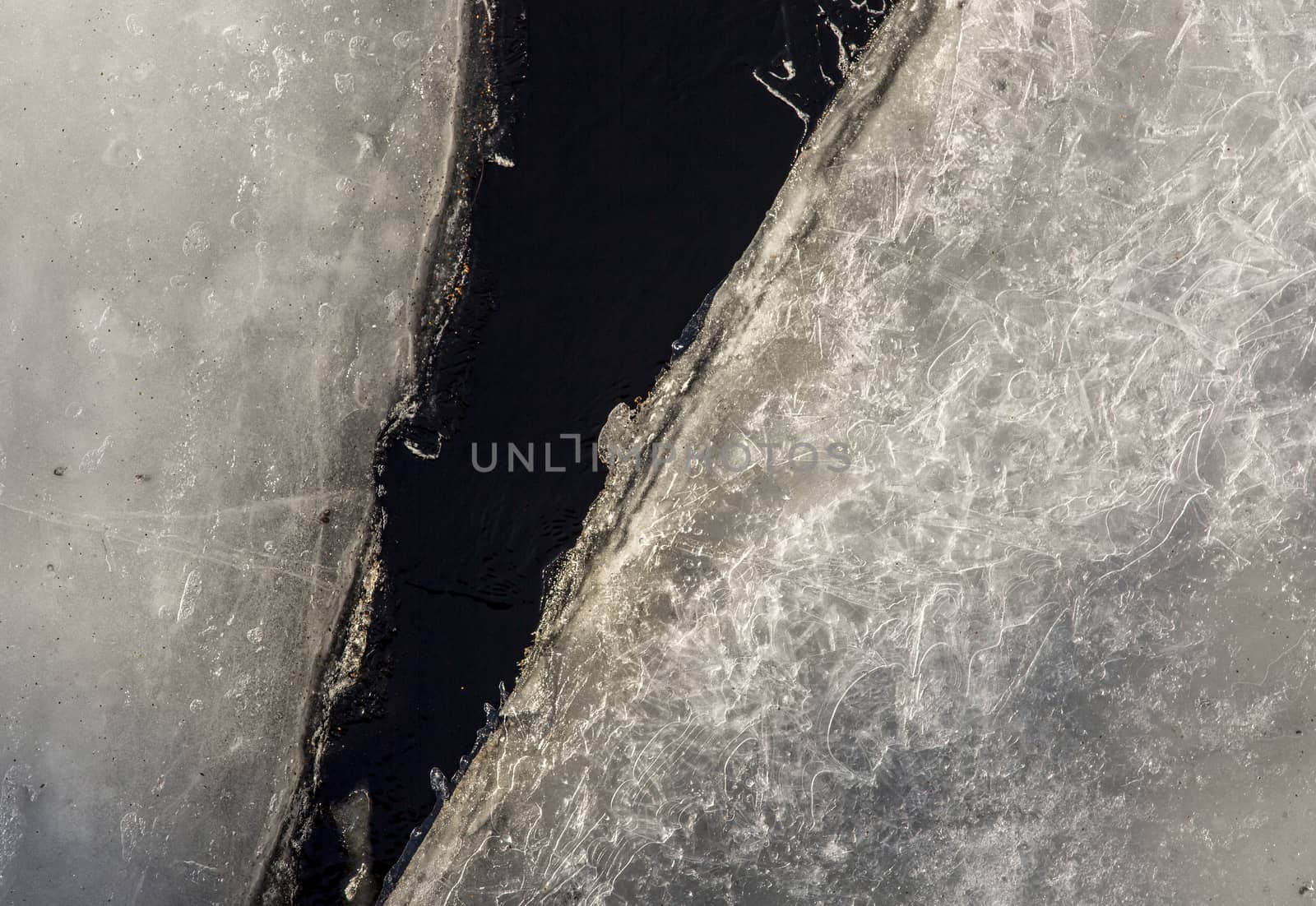 Pair of Ice Sheets In River that is Thawing.