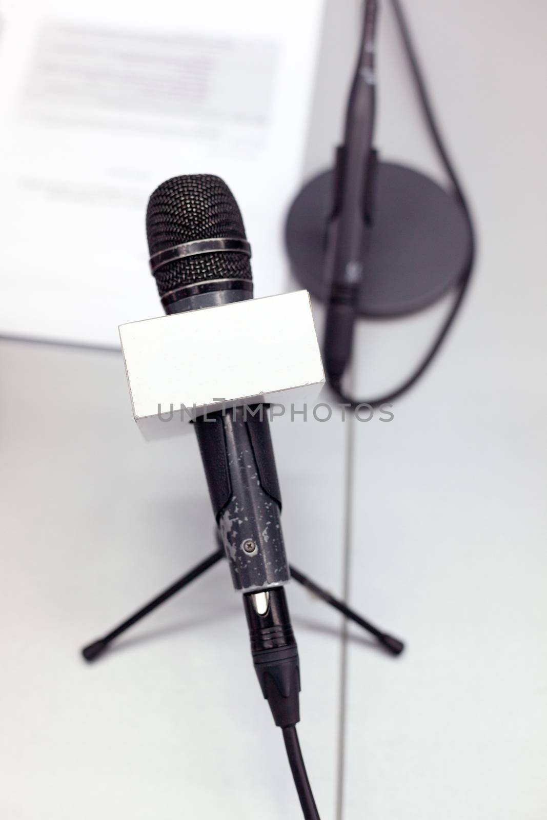 Microphone at press conference by wellphoto