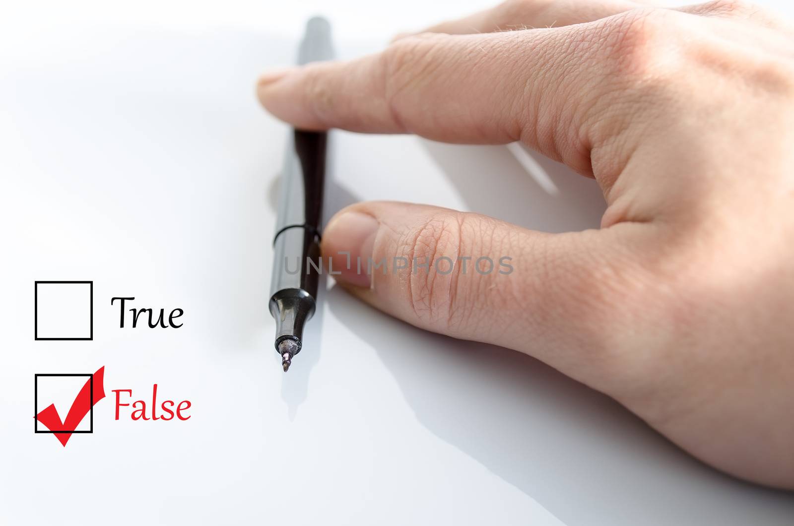 Pen in the hand isolated over white background