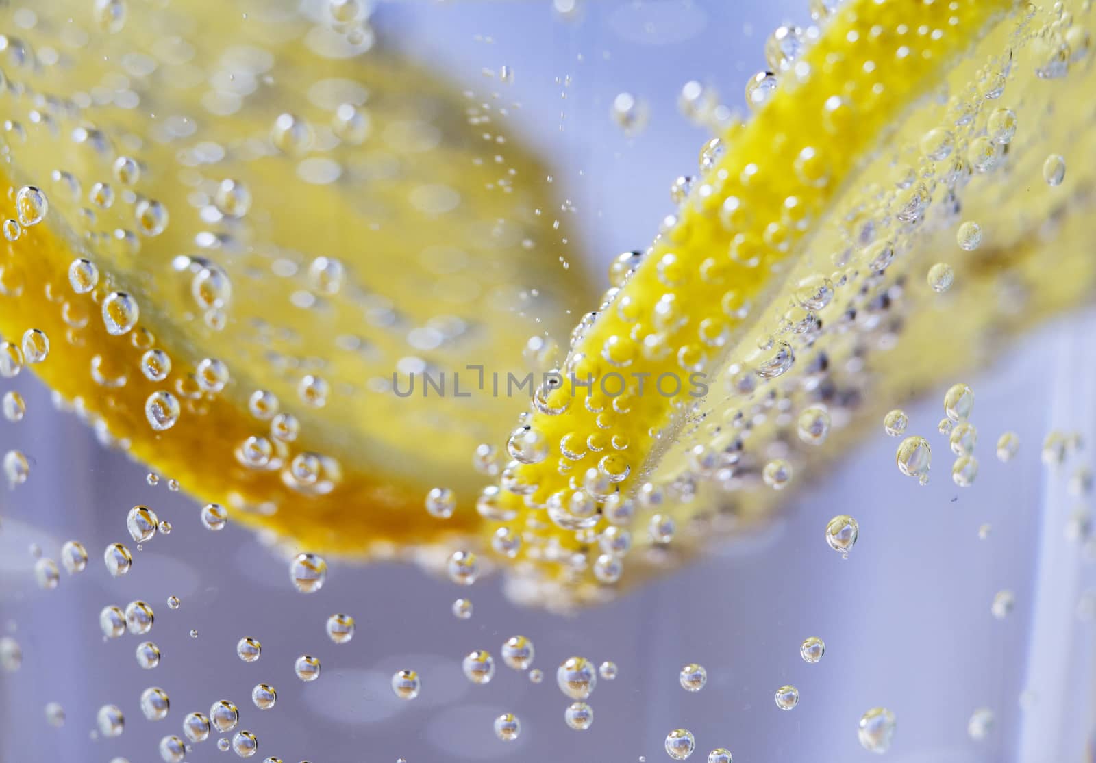 Lemon Slices in Clear Soda Water (Bubble Background Macro) by leieng