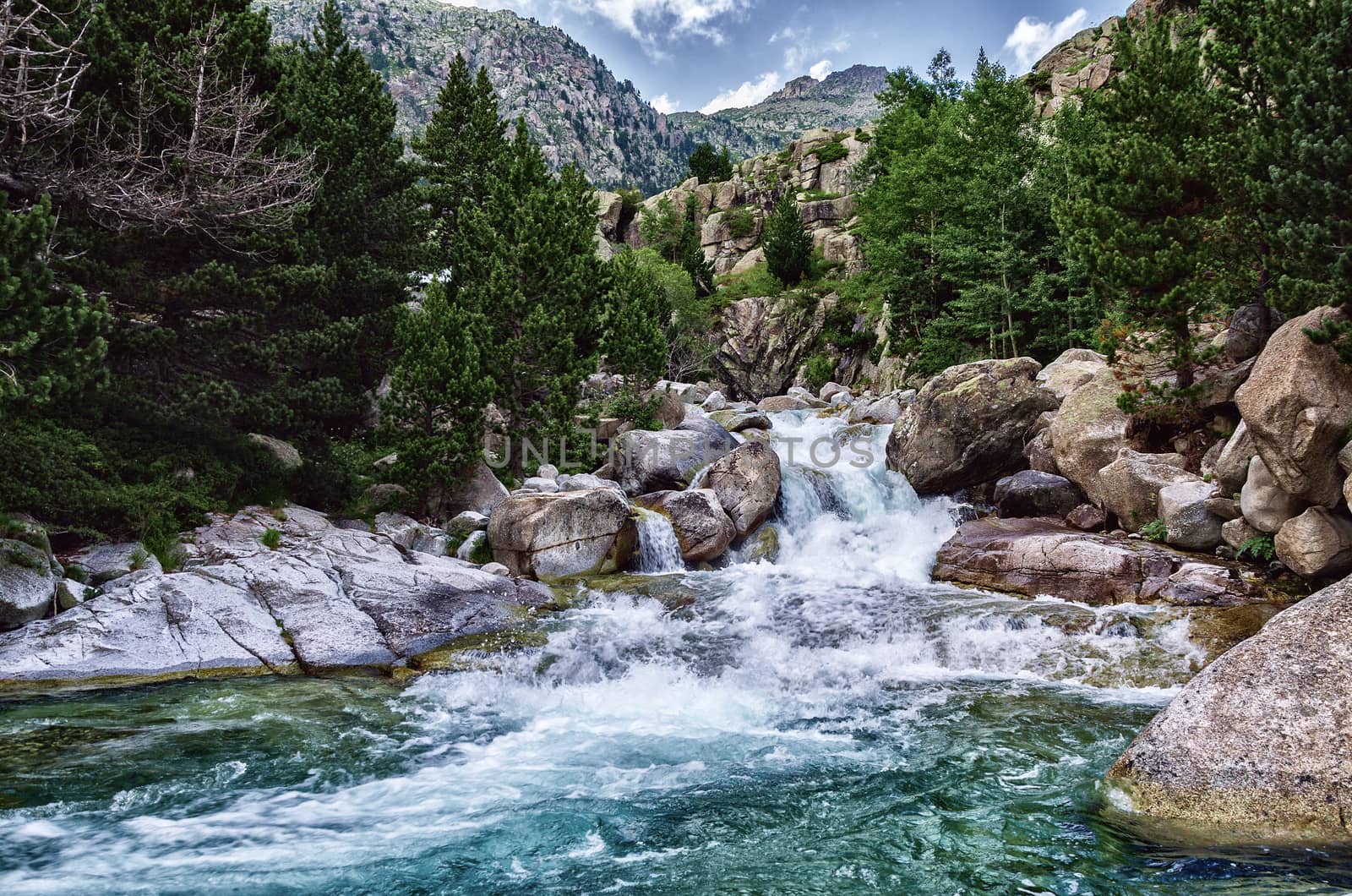 Beautiful river into the Pyrenees mountains with cristal clear water.