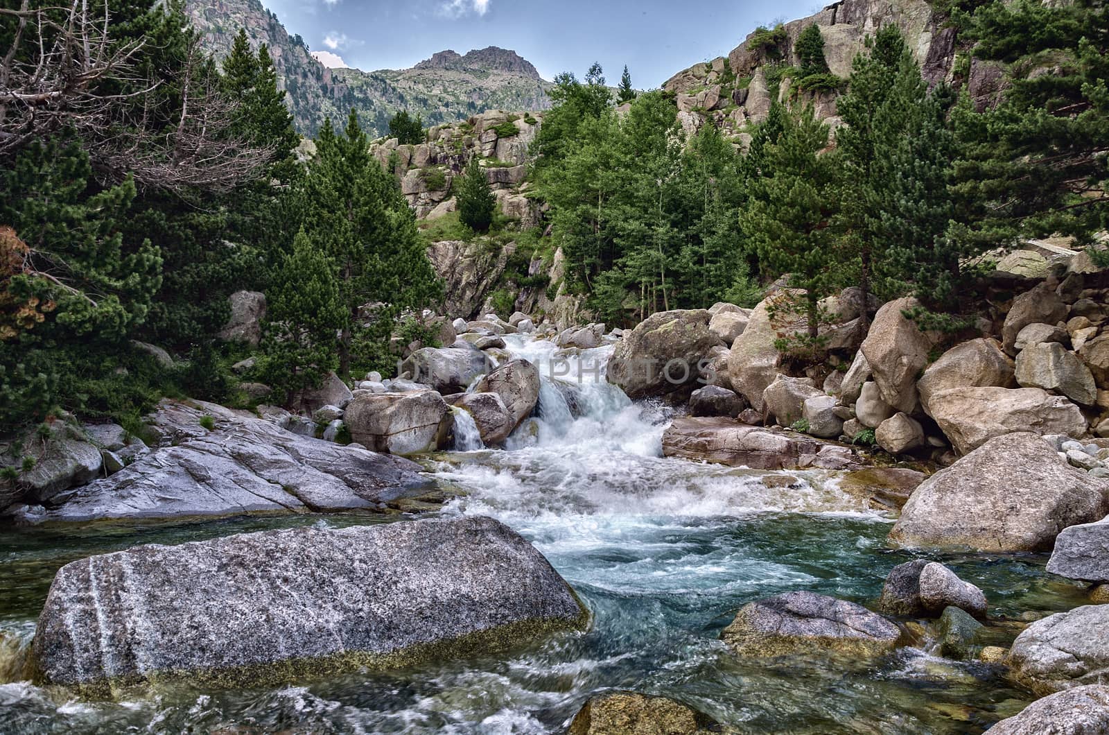 Beautiful river into the Pyrenees mountains with cristal clear water.