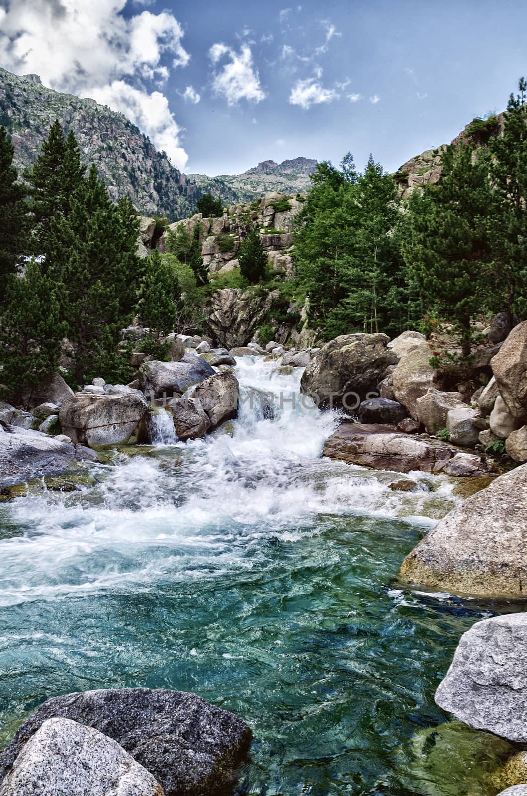 Beautiful river into the Pyrenees mountains with cristal clear water.
