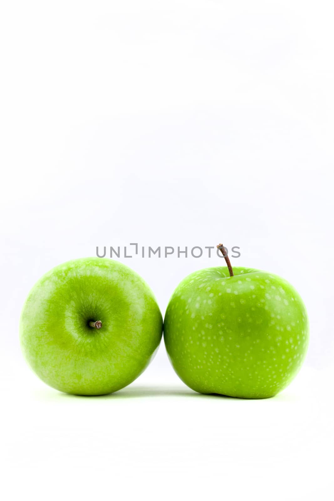Fresh green apple isolated on white background by nopparats