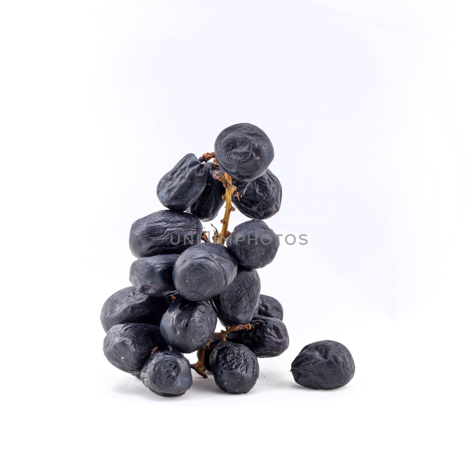 Old violet grape isolated on white background .