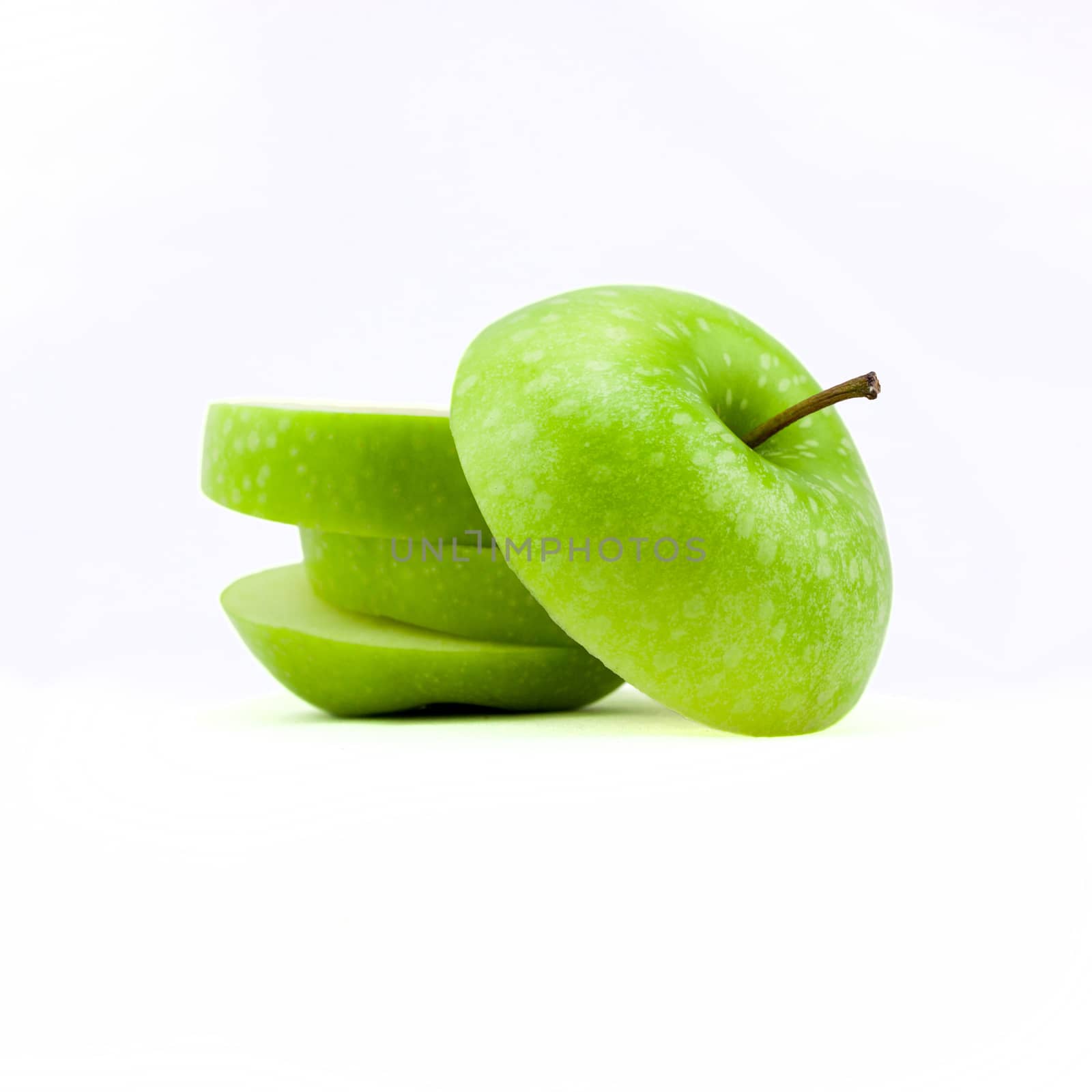 Fresh green apple isolated on white background by nopparats