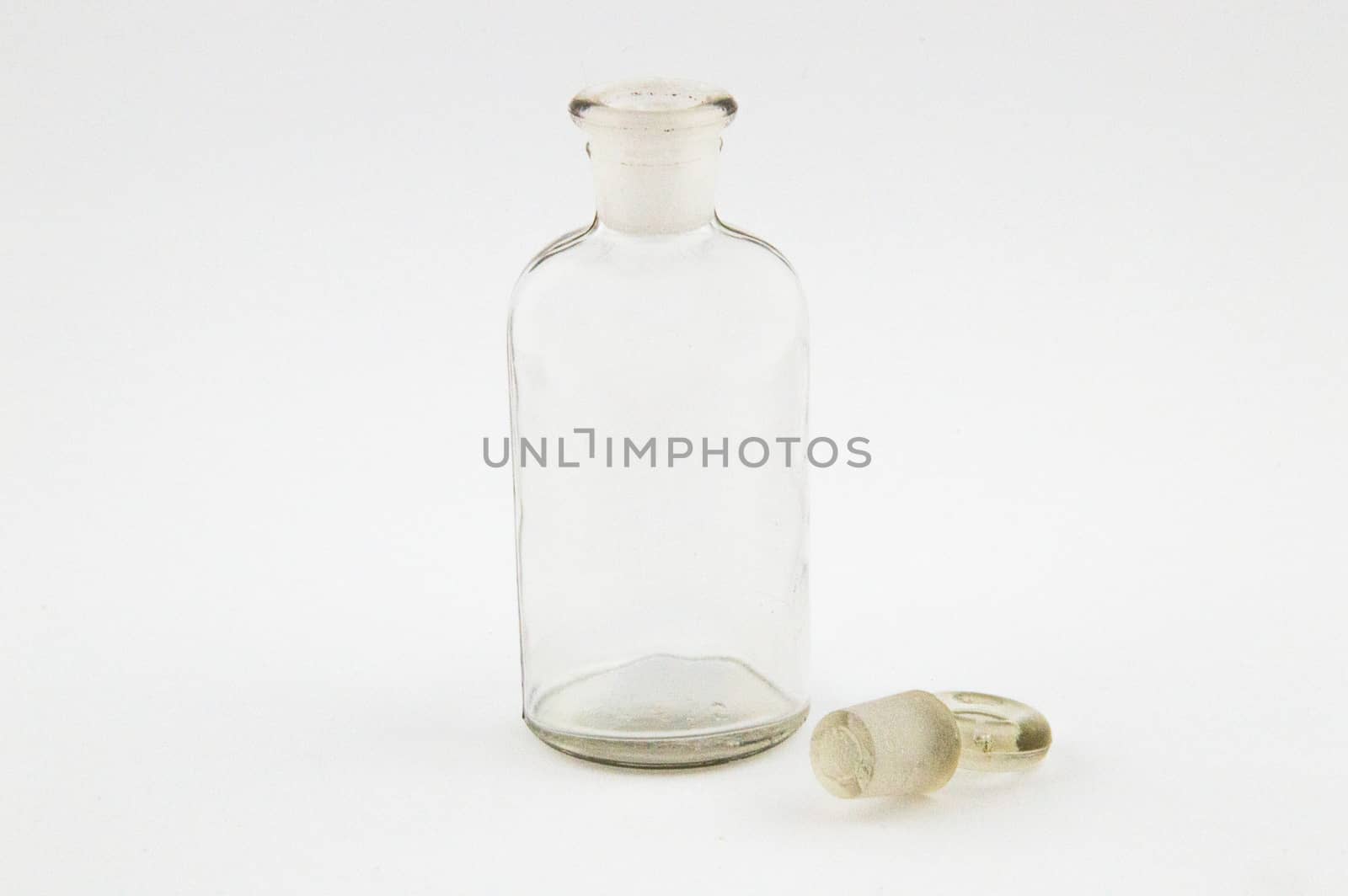 Glass bottle pharmacy in light gray background