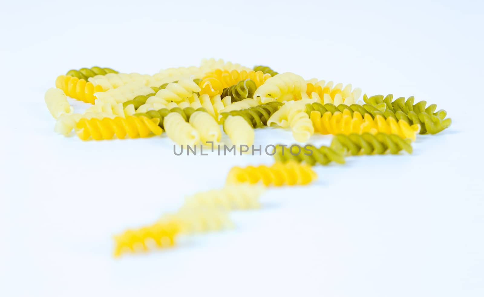 Uncooked macaroni isolated on white background