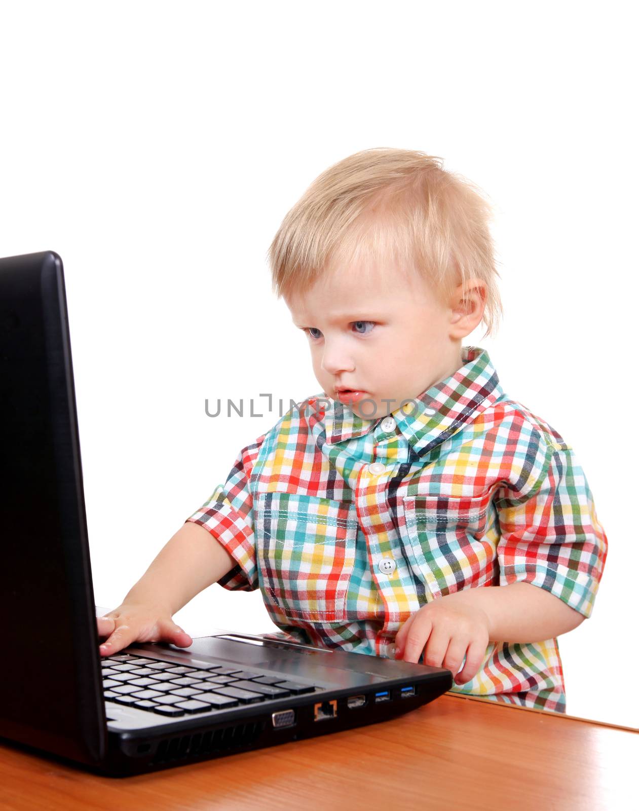 Serious Baby Boy with Laptop Isolated on the White Background