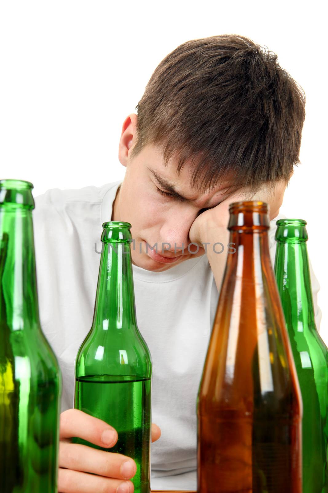Sad and Depressed Young Man in Alcohol addiction on the White Background