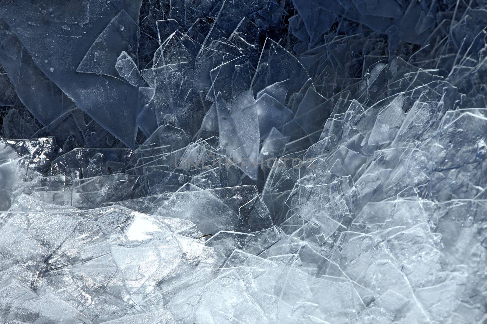 Cracked blue ice on frozen water