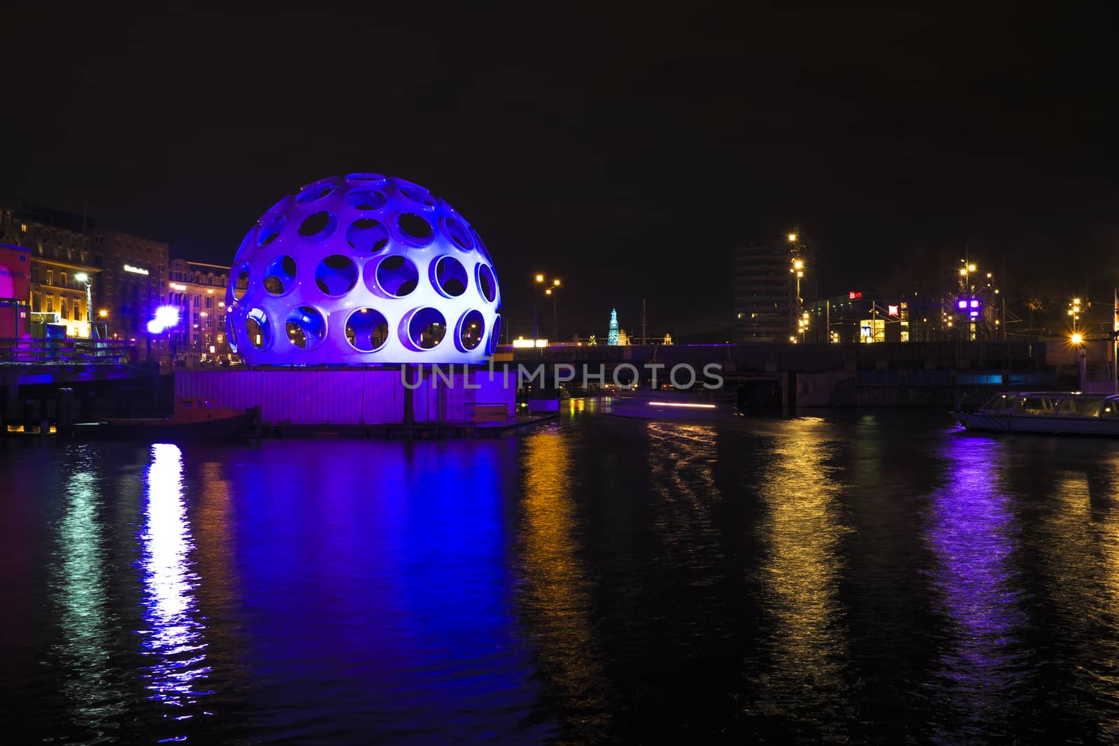 AMSTERDAM, NETHERLANDS - DEC 26 2013: Piece of light art at night during the Amsterdam Light festival in Amsterdam, the Netherlands on December 26, 2013