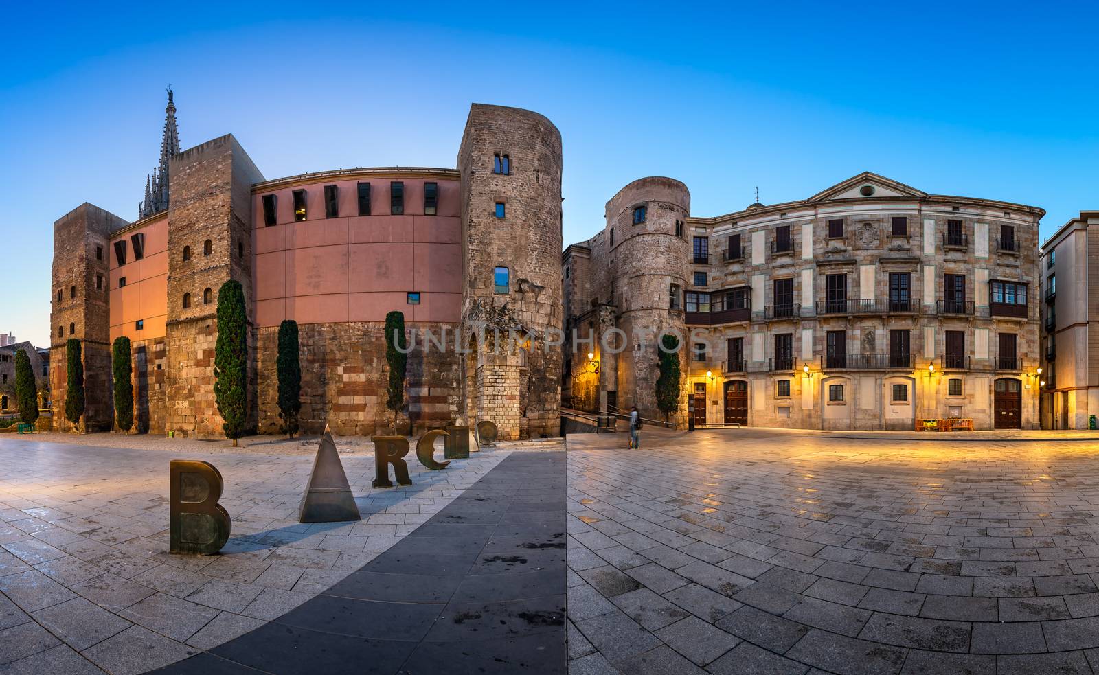 BARCELONA, SPAIN - NOVEMBER 16, 2014: Ancient Roman Gate and Placa Nova in Barri Gotic Quarter, Barcelona. Barri Gotic is the centre of the old city of Barcelona. It stretches from La Rambla to Via Laietana.