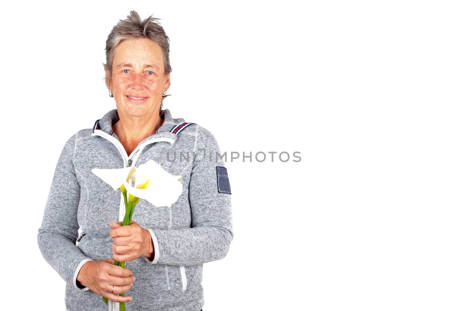 Beautiful mature woman with blossoming cala flowers by devy