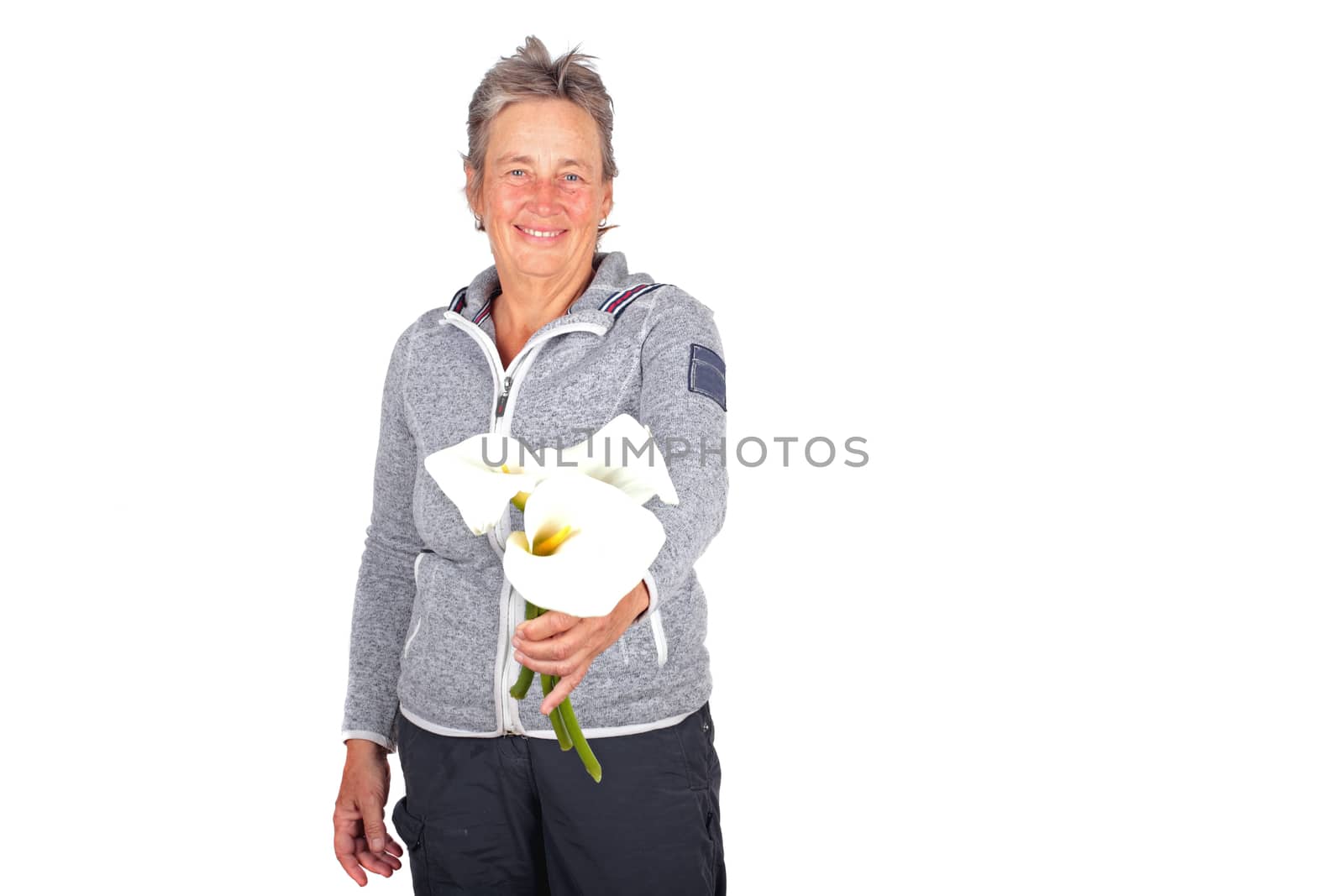 Beautiful mature woman with blossoming cala flowers