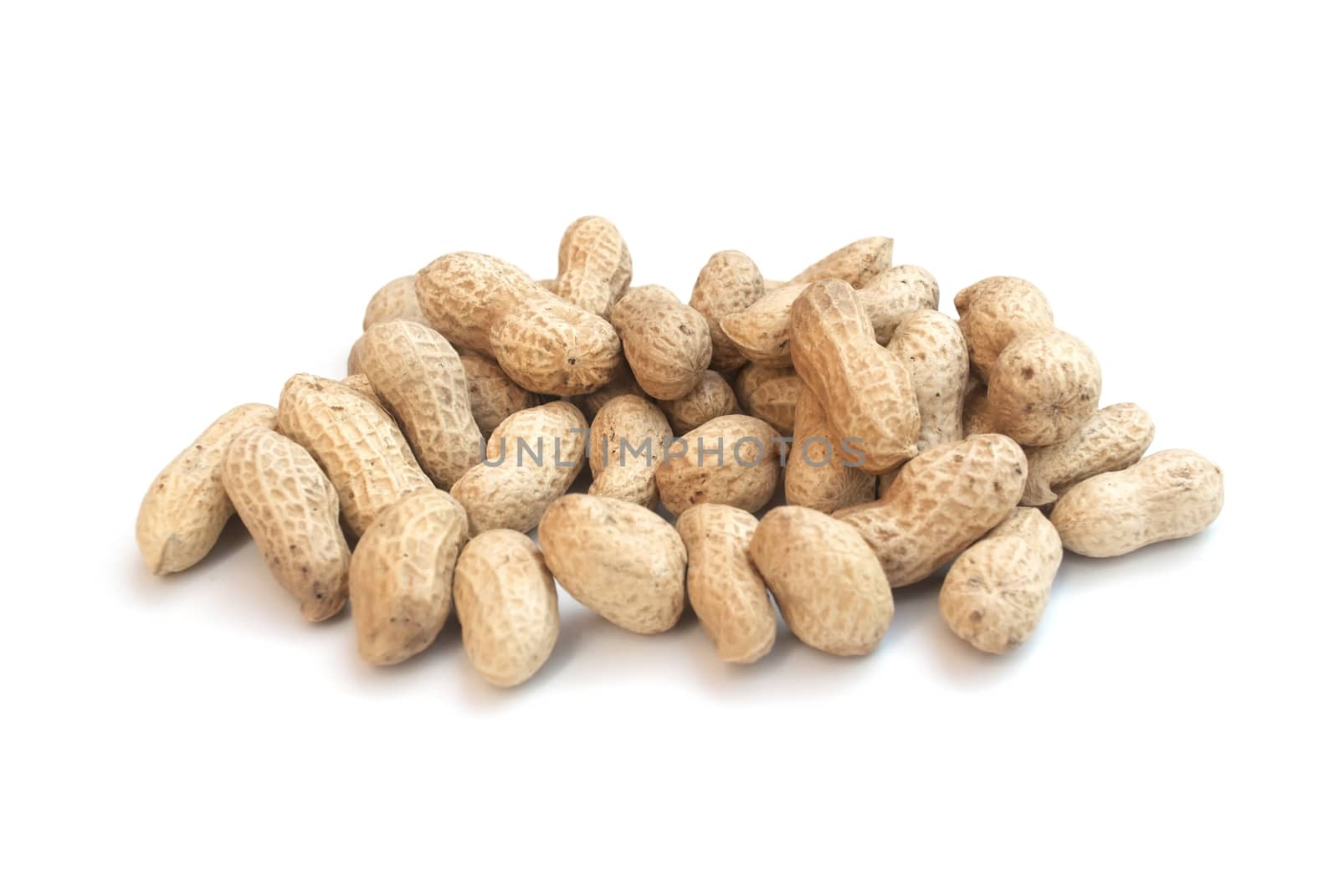 Monkey nuts, peanuts or groundnuts in shells, isolated on a whit by head-off
