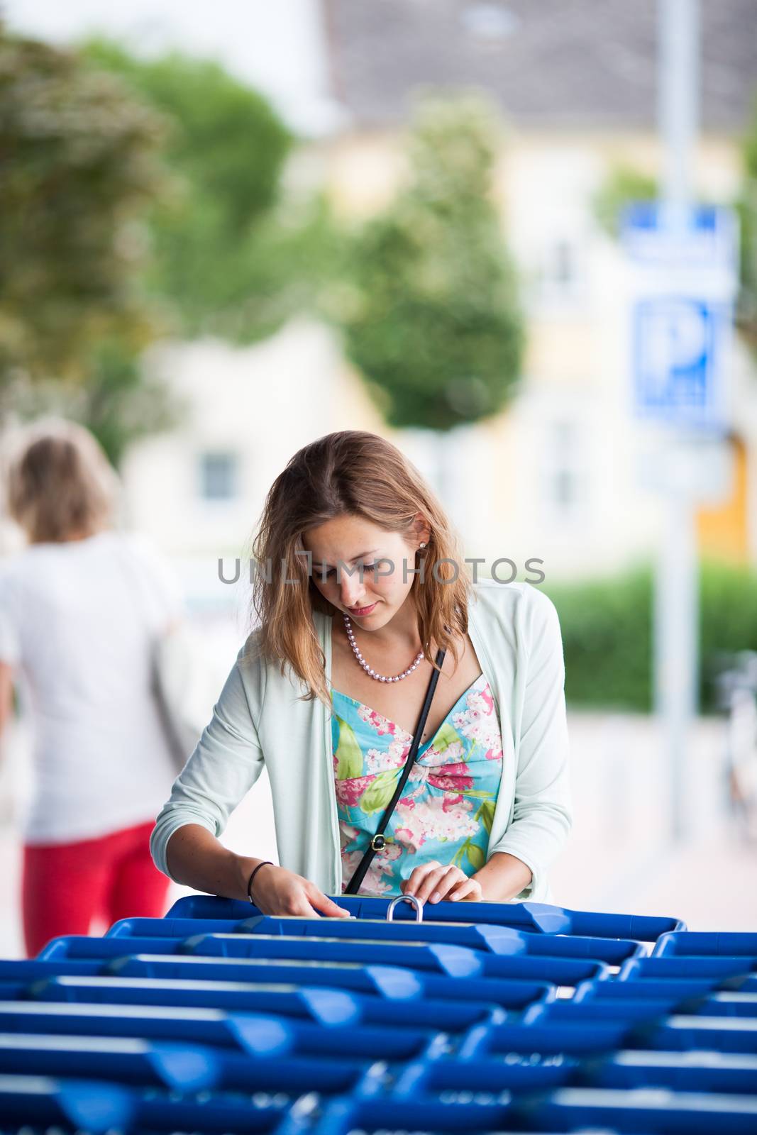 Beautiful young woman going shopping for groceries by viktor_cap