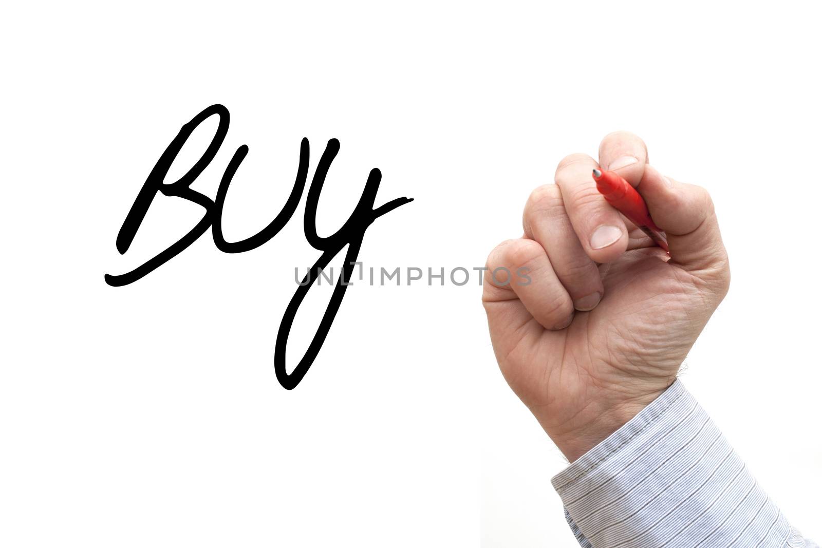A Photo / Illustration of a Hand Writing 'Buy'