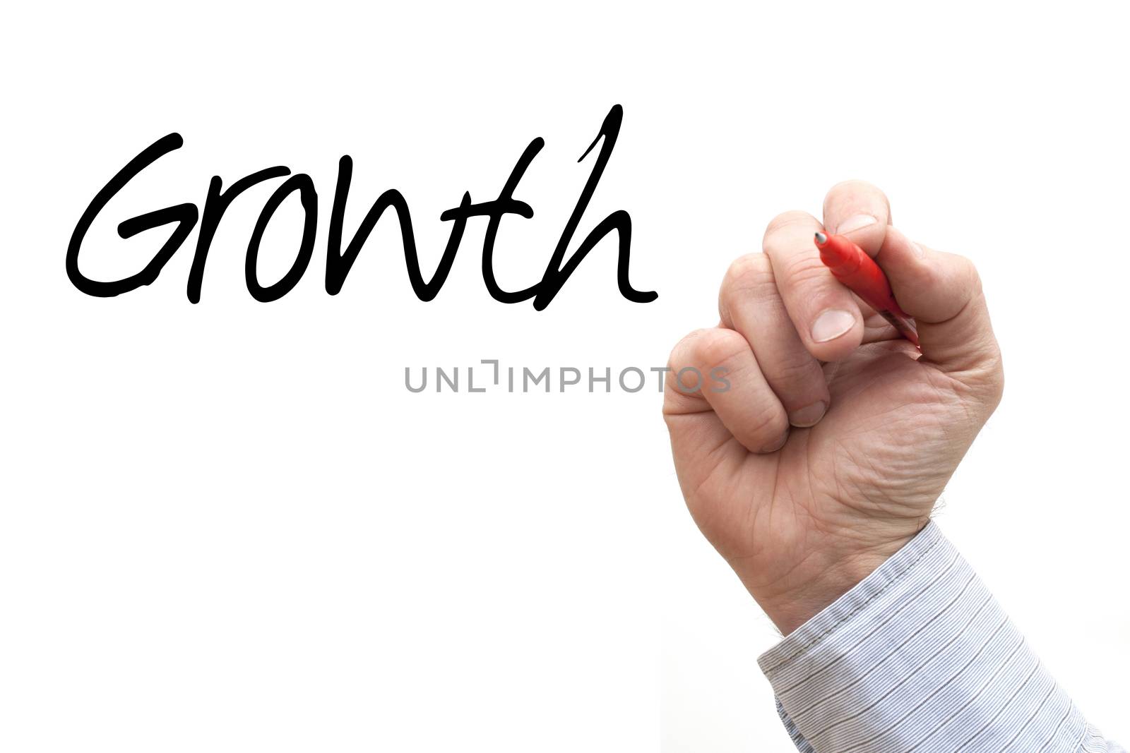 A Photo / Illustration of a Hand Writing 'Growth'