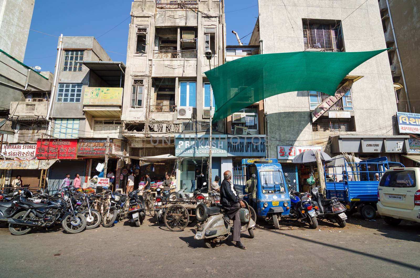 Ahmedabad, India - December 28, 2014: Indian people on Street of the Ahmedabad city on December 28, 2014. Ahmedabad is the largest city and former capital of the western Indian state of Gujarat.