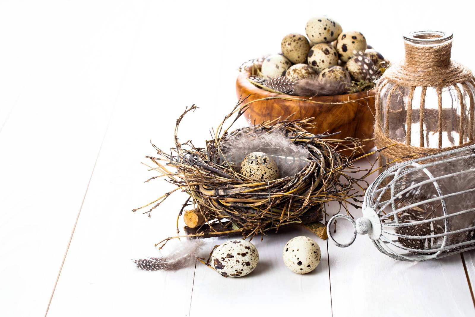 quail eggs on white wooden background