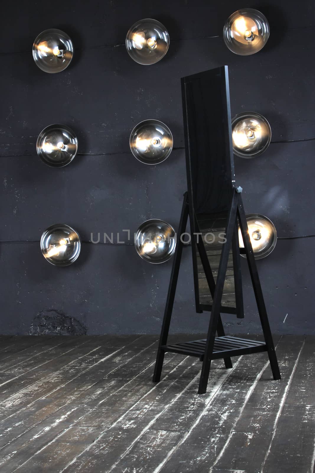 Mirror on stege with set of lamps background