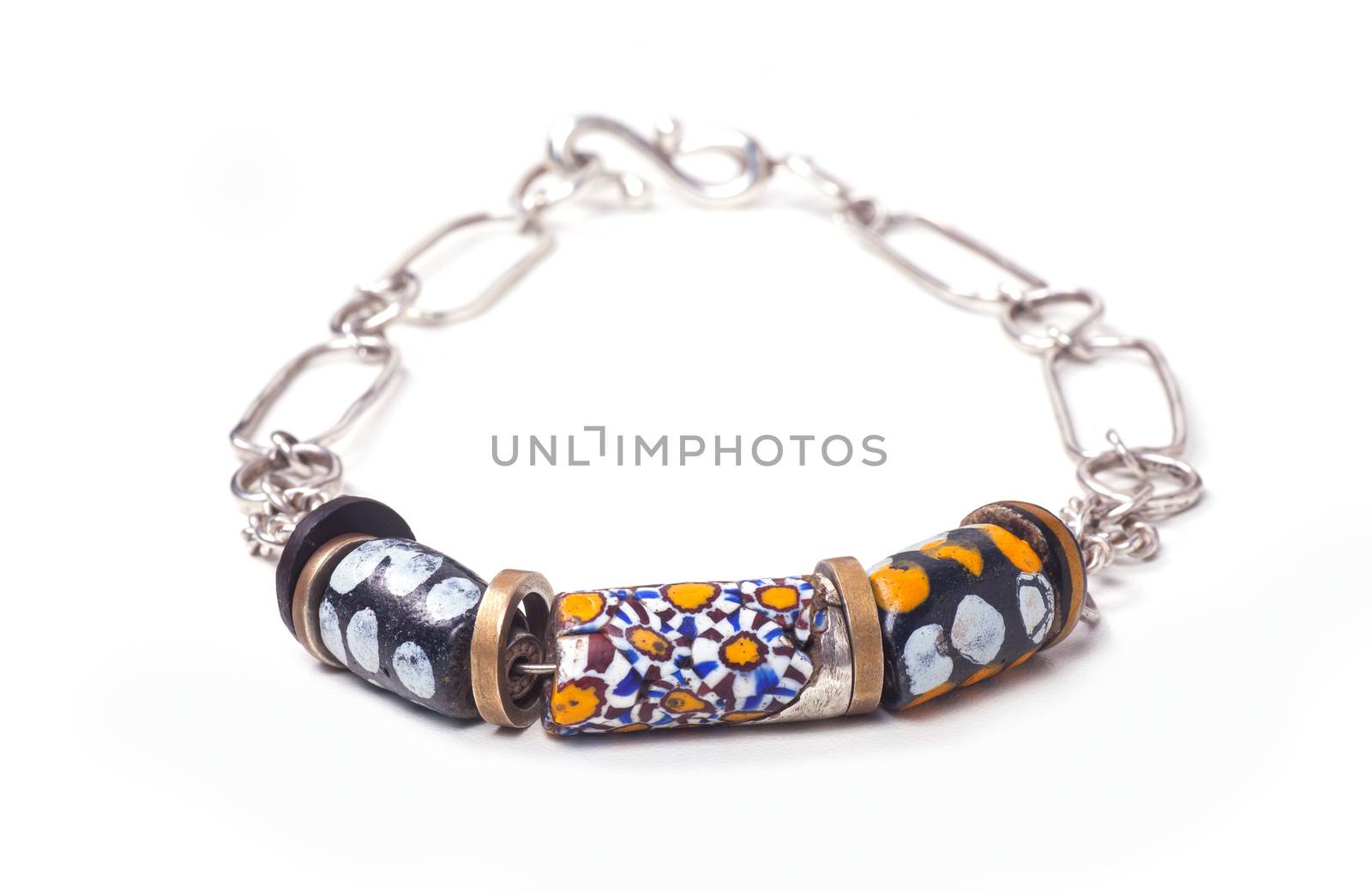 Close up of silver and painted stone necklace isolated on white background, manufactured by Ornella Salamone