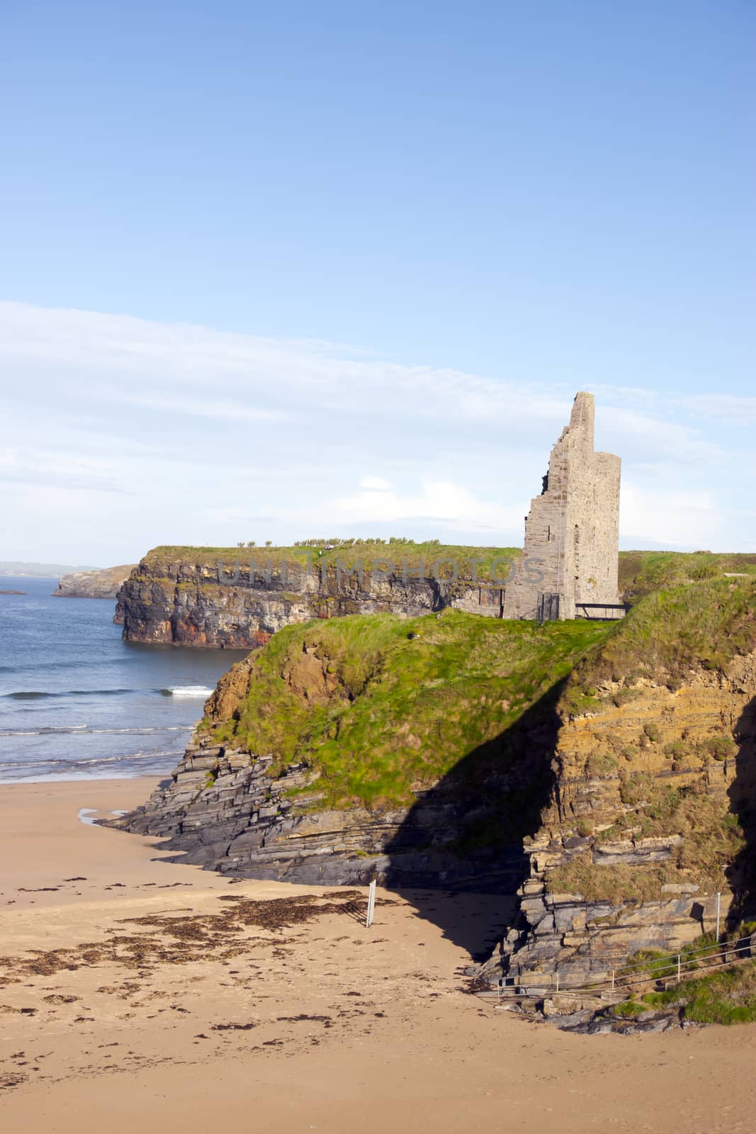 view of the castle beach and cliffs in Ballybunion by morrbyte