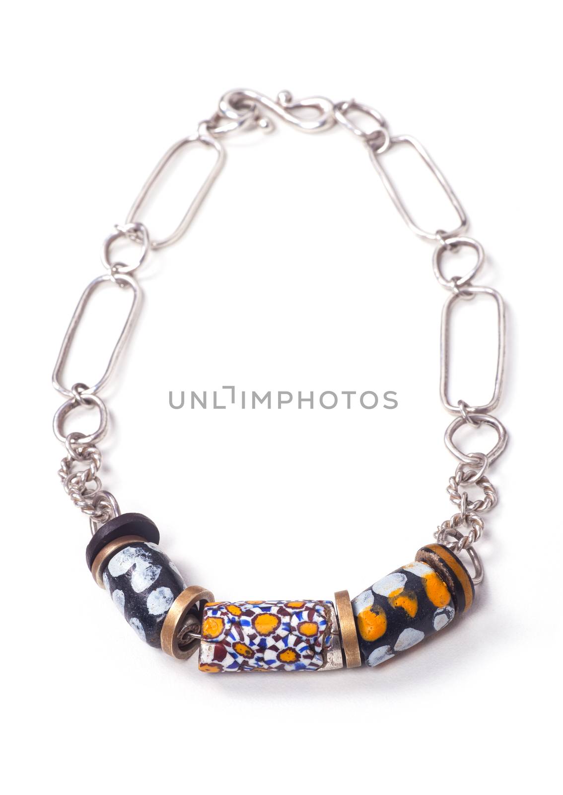 Close up of silver and painted stone necklace isolated on white background, manufactured by Ornella Salamone