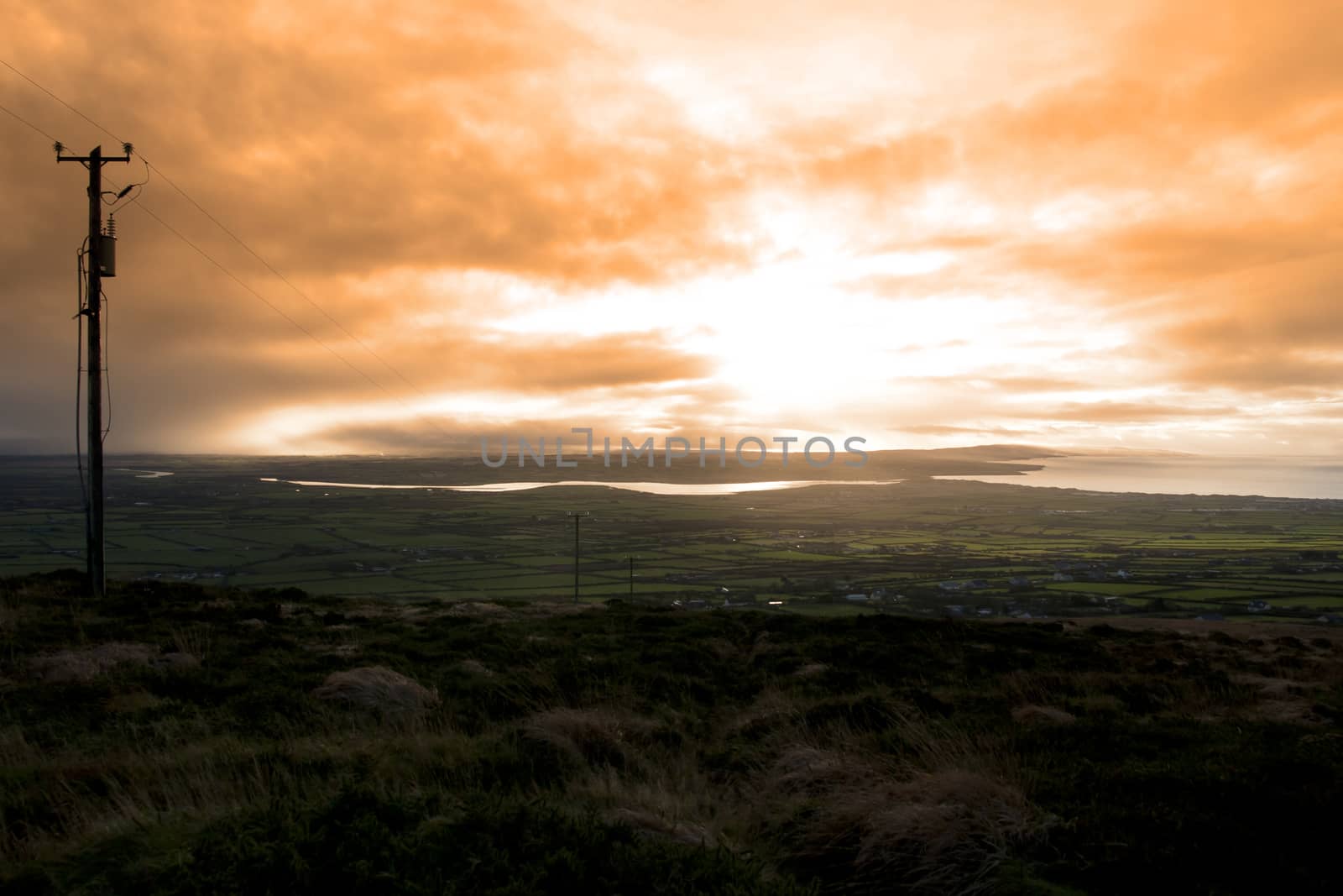 view of the Kerry coast with telegraph masts going into the countryside