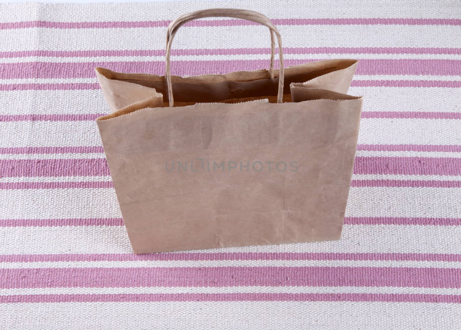 Brown paper shopping bag on a beautiful background by mcherevan