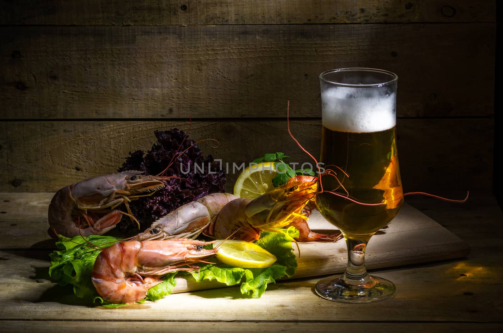 still life with beer, shrimp and fresh herbs