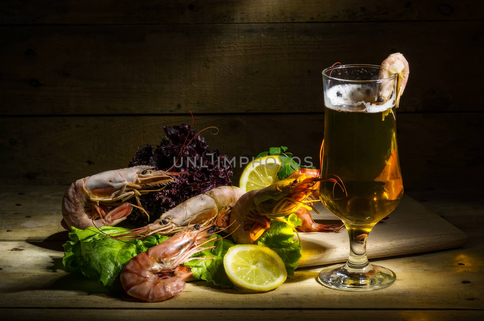 still life with beer, shrimp and fresh herbs