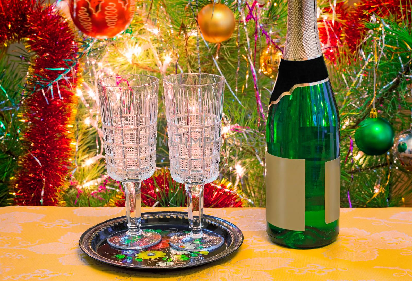 Christmas holiday, wine and glasses near a Christmas fir-tree. by georgina198