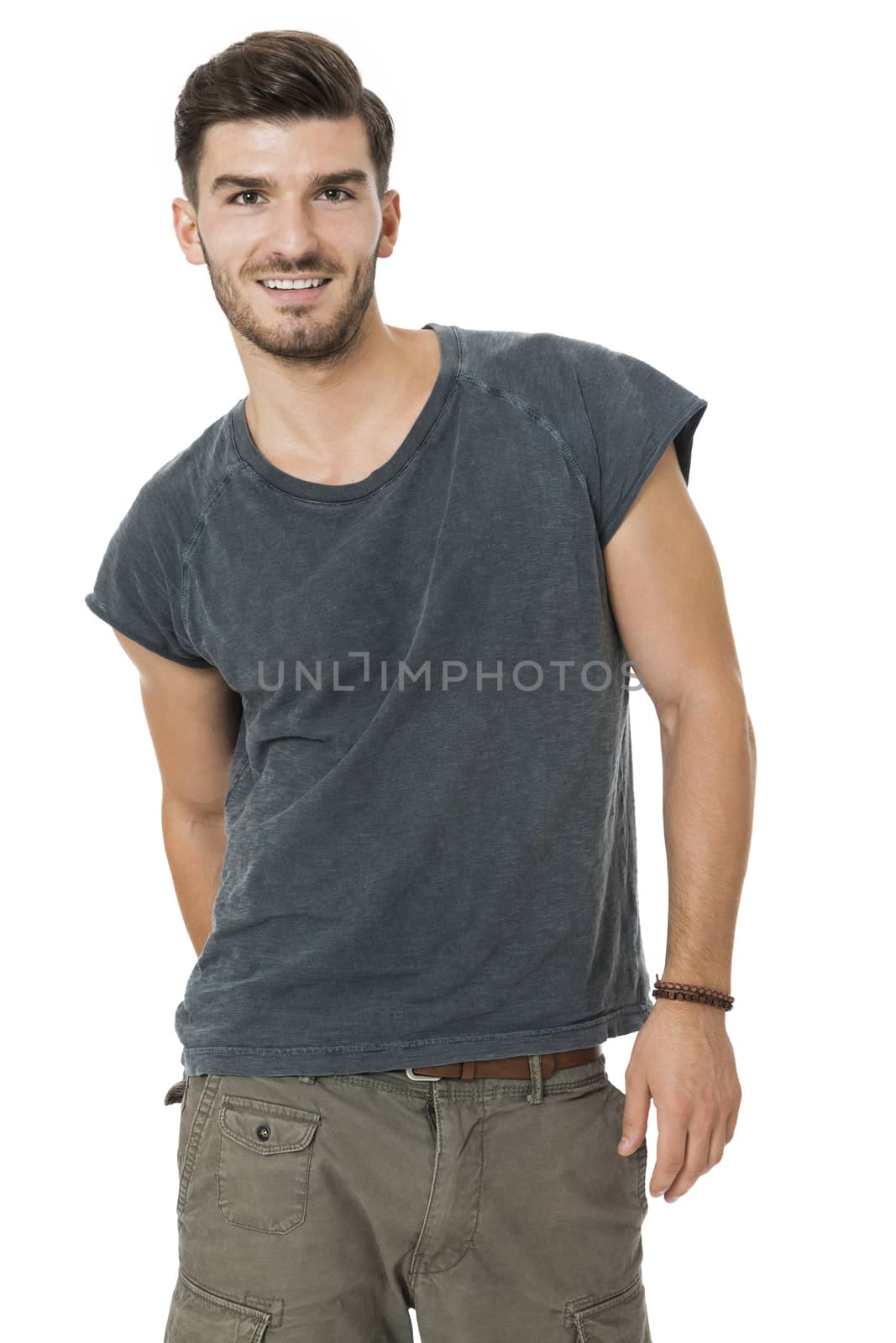 Handsome bearded young man with a lovely charismatic smile wearing a cotton t-shirt, isolated on white