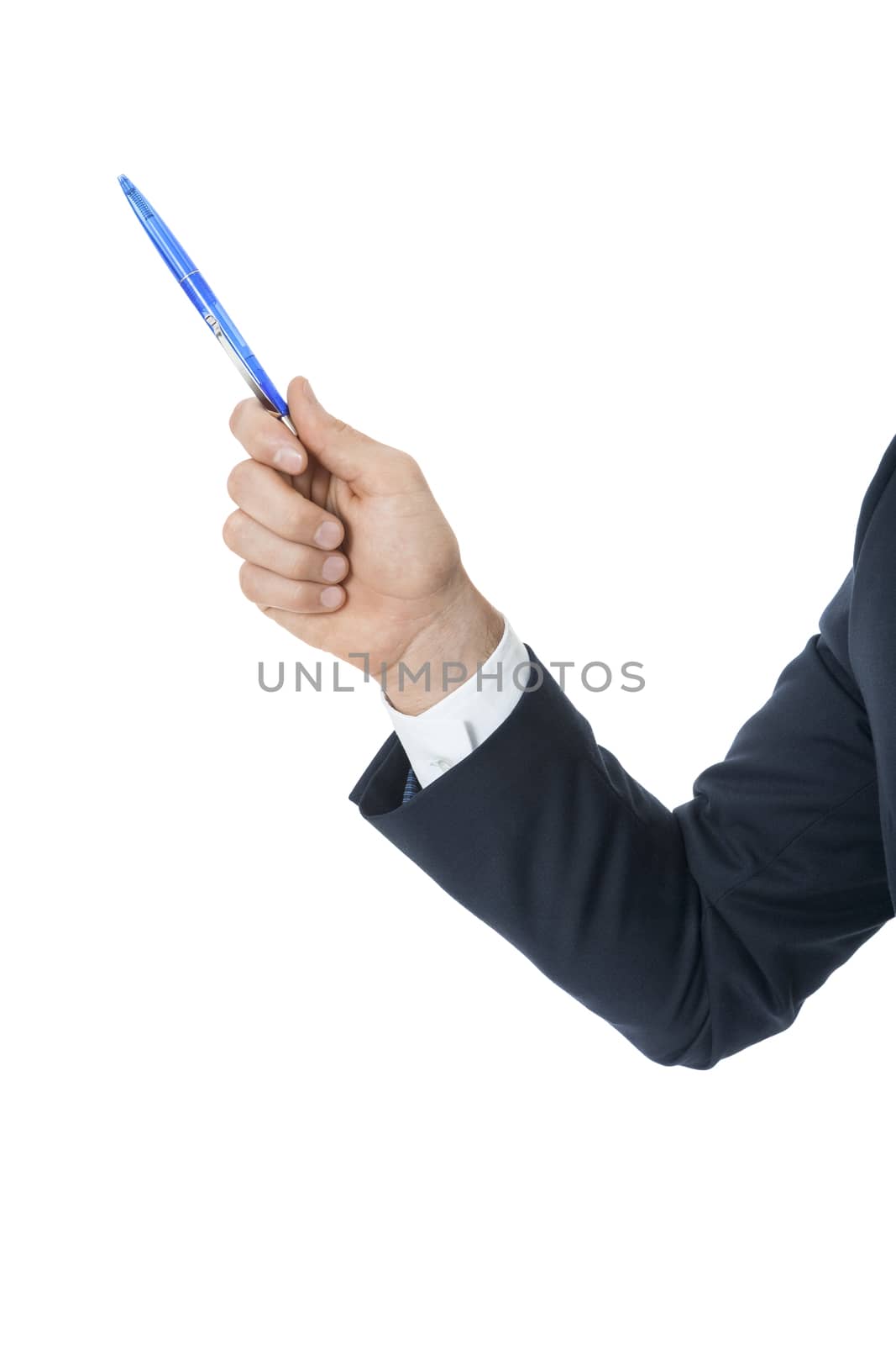 Stylish young businessman doing a presentation, making a selection or showing something pointing to the left of the frame with a pen in his hand as he stands sideways to the camera, isolated on white