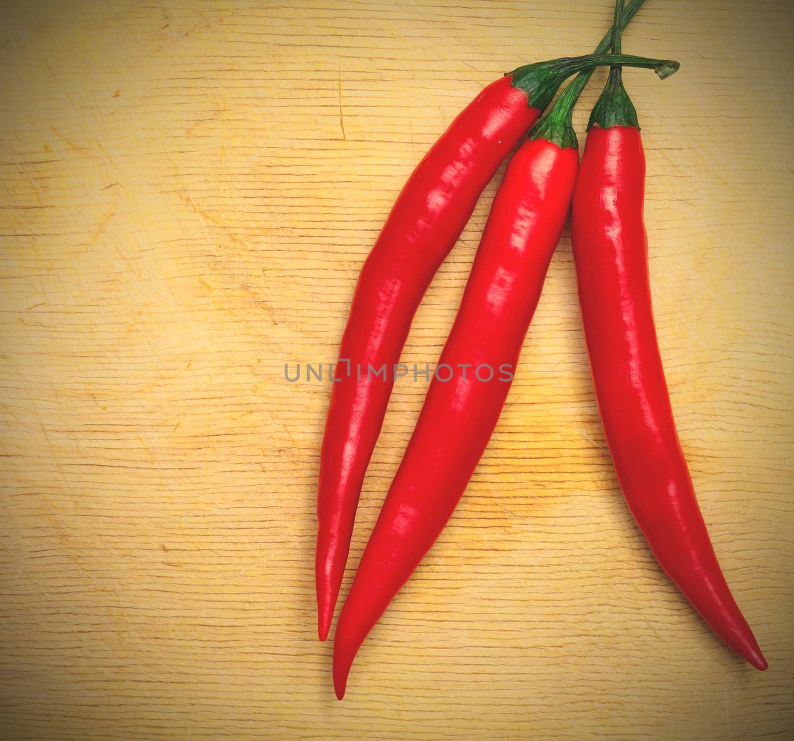 three red hot chili peppers by Astroid