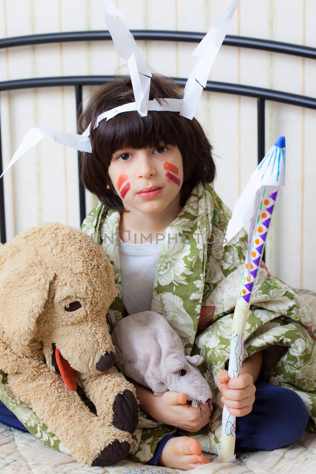 boy in the image of the American Indian at home