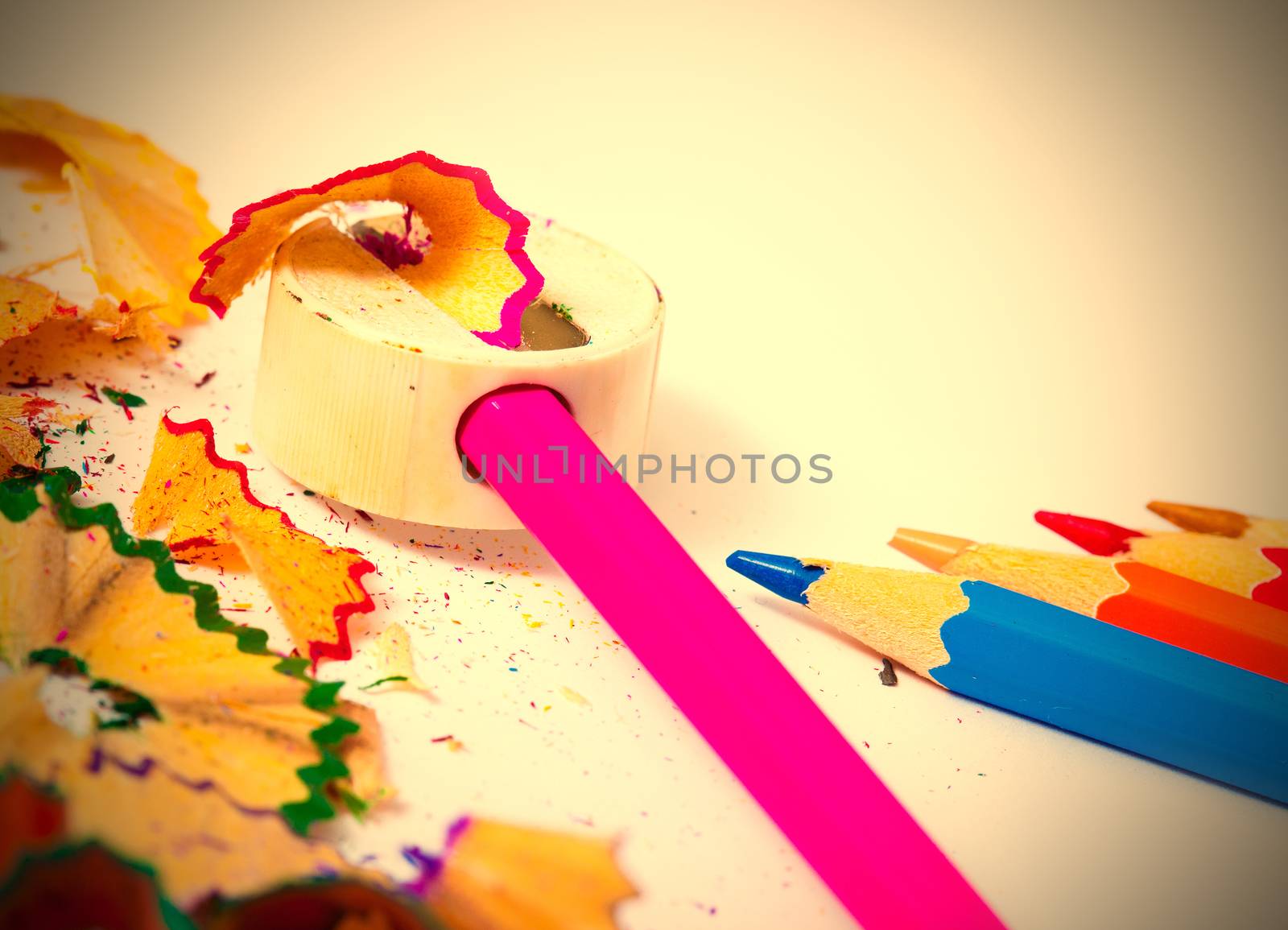 colored pencils, sharpener and shavings by Astroid