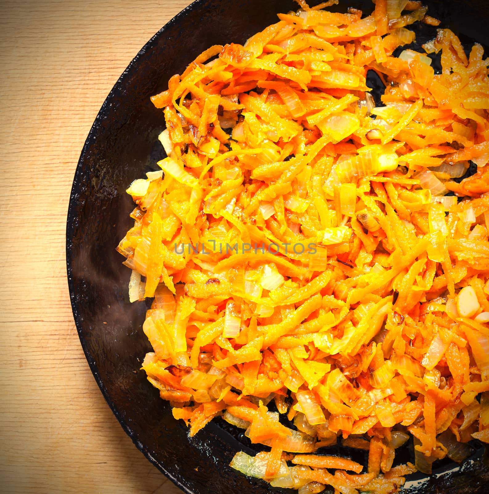 roasted carrots and onions on a vintage cast iron skillet. instagram image retro style