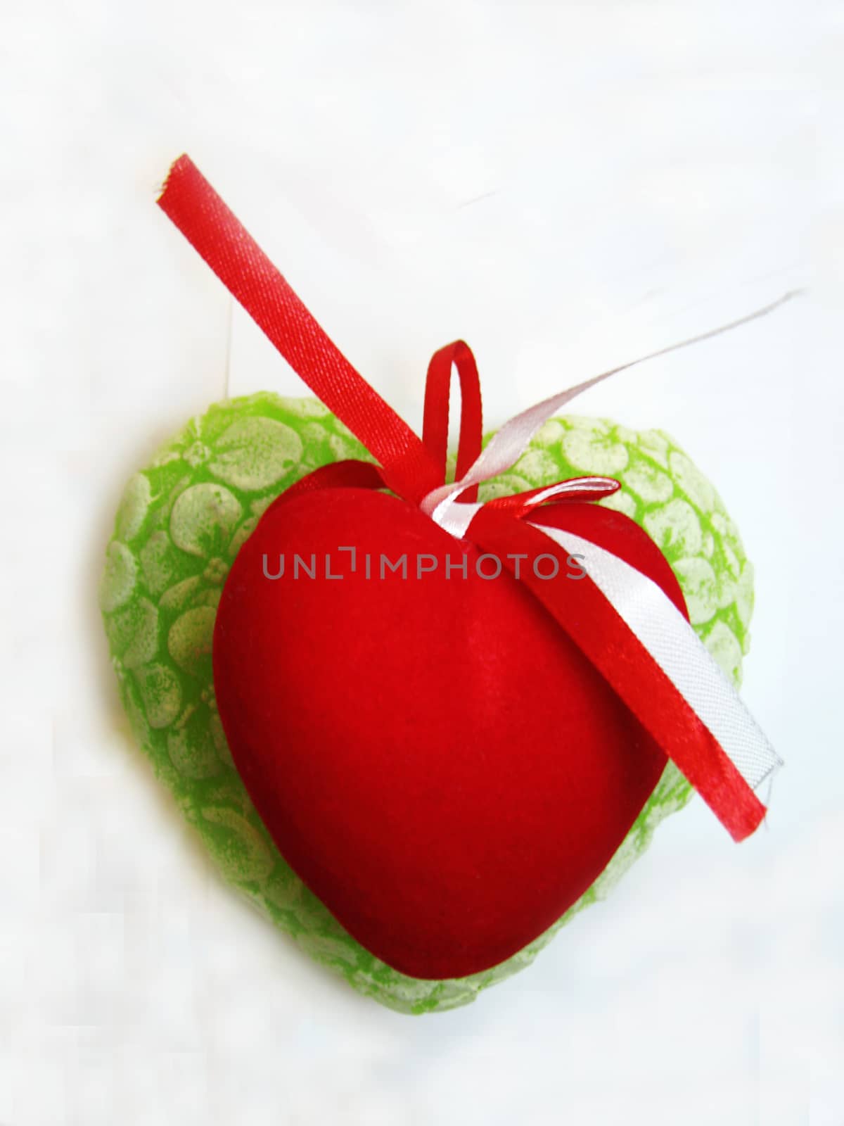 Green and red valentine heart isolated on the white background
