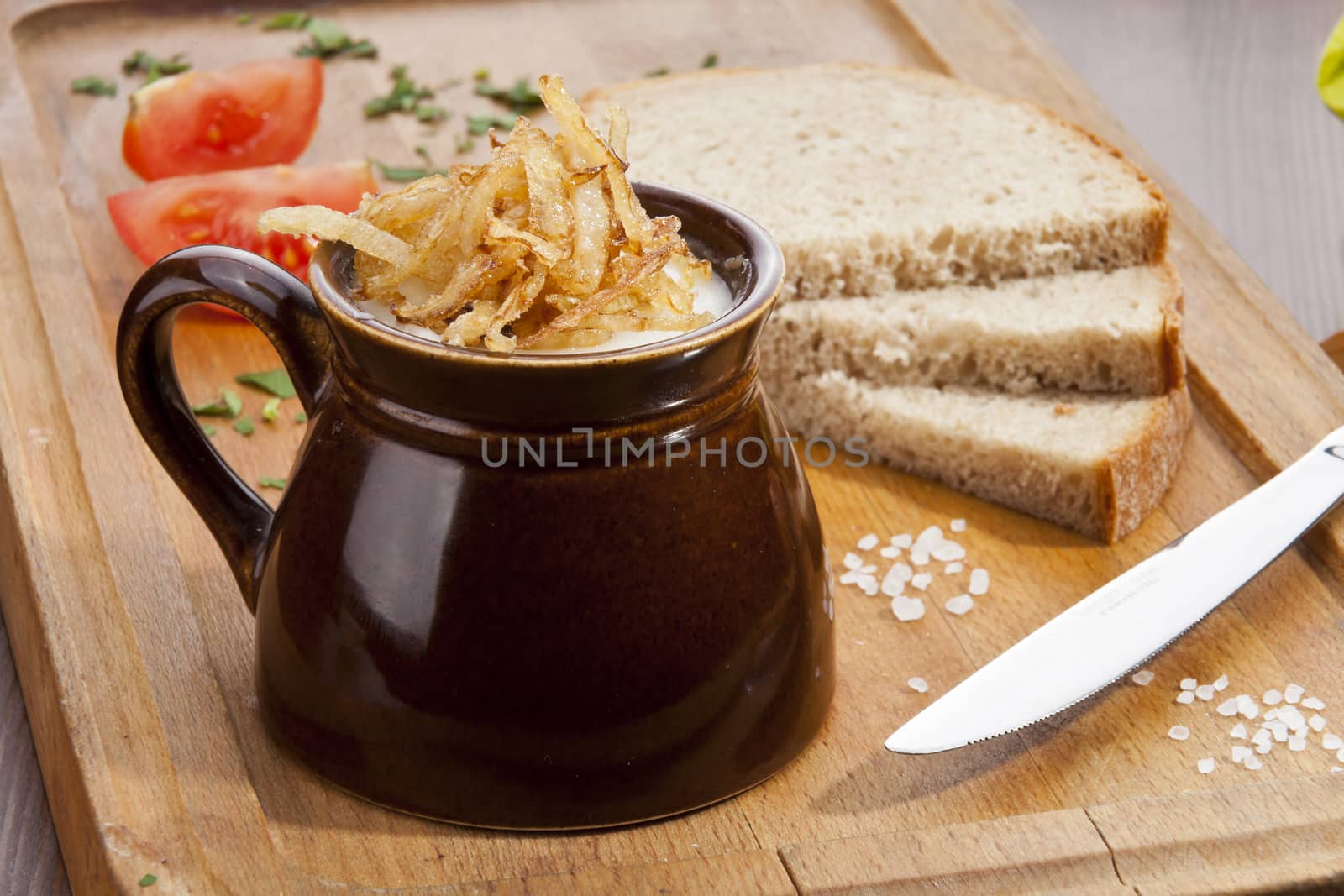 Pork lard with the fried onion in the pot and dark bread