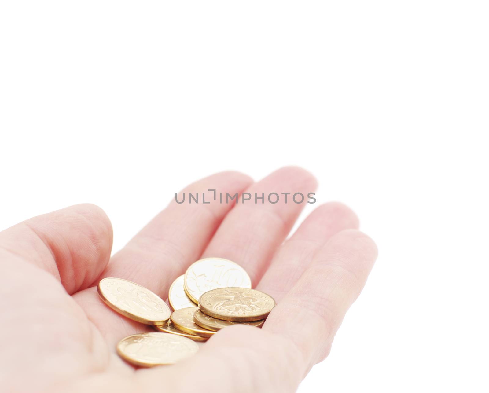 A few copper coins in hand. Dimes on palm, on white,isolated