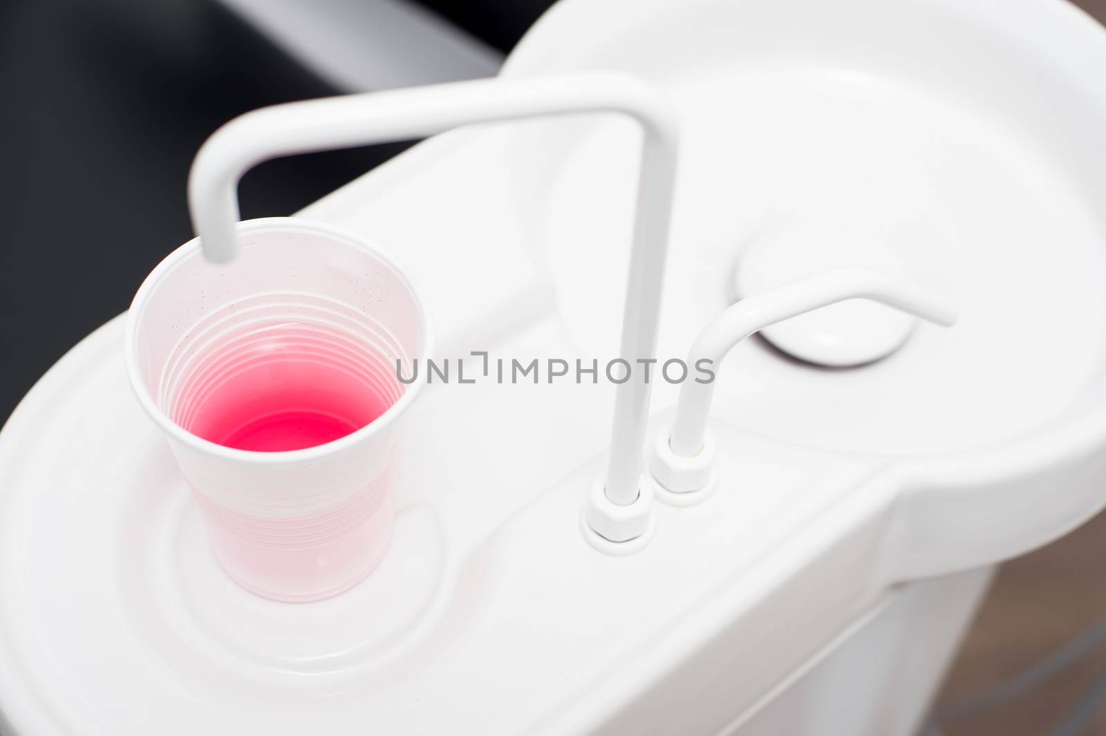 Close up of a cup under the sink at dental clinic