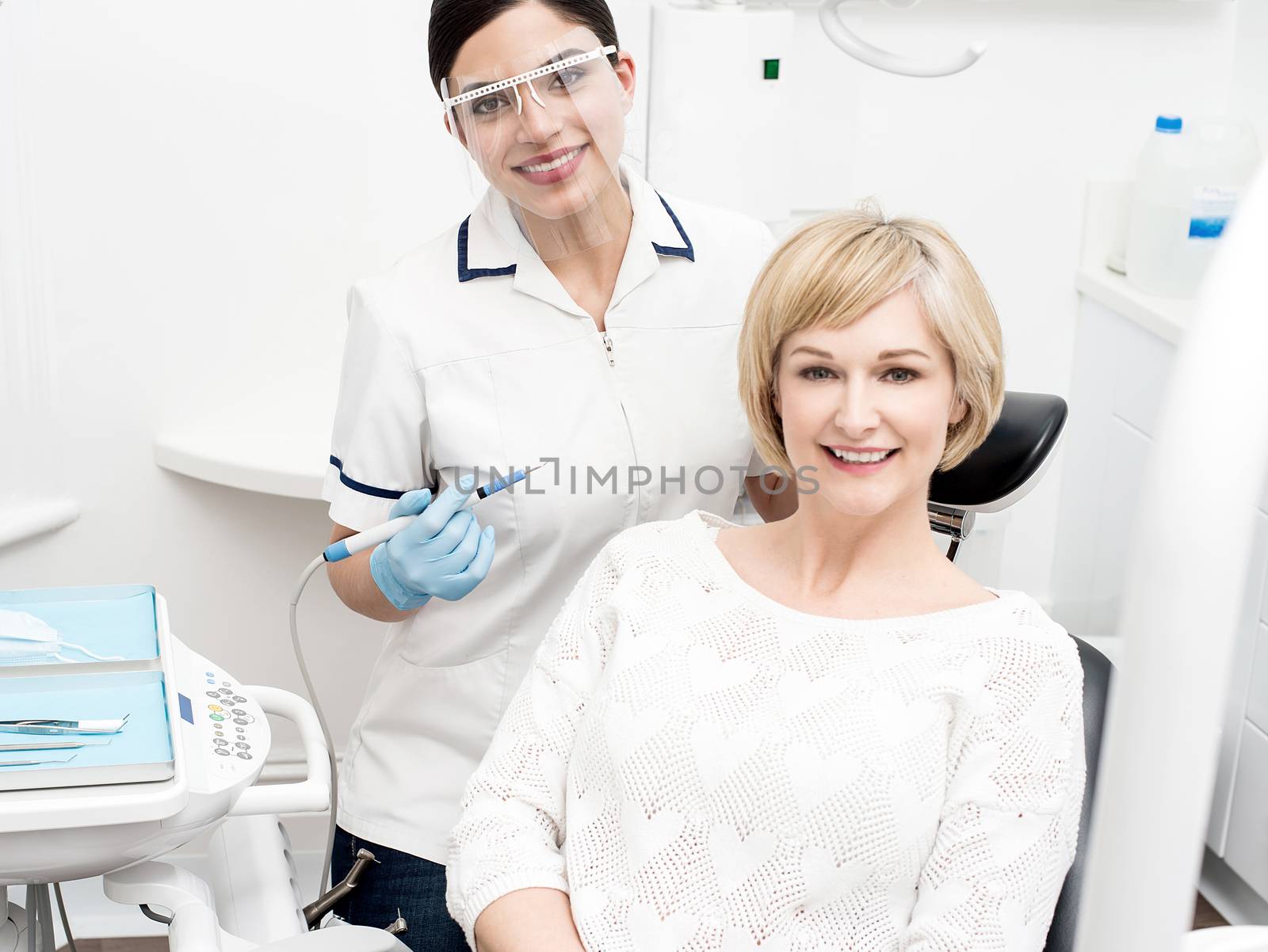 Female patient smiling after her teeth cleaning
