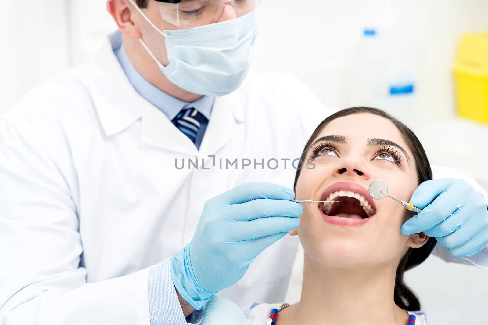 Teeth checkup at dentist clinic by stockyimages